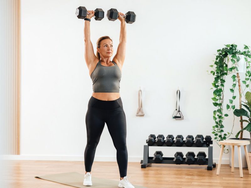 Woman working out with dumbells