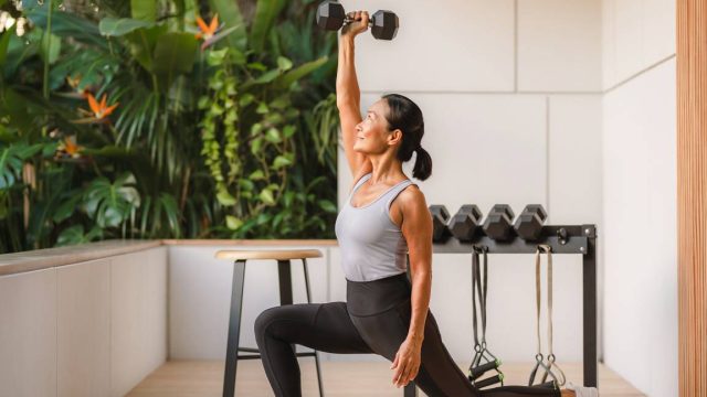 A woman performing press up lunges.