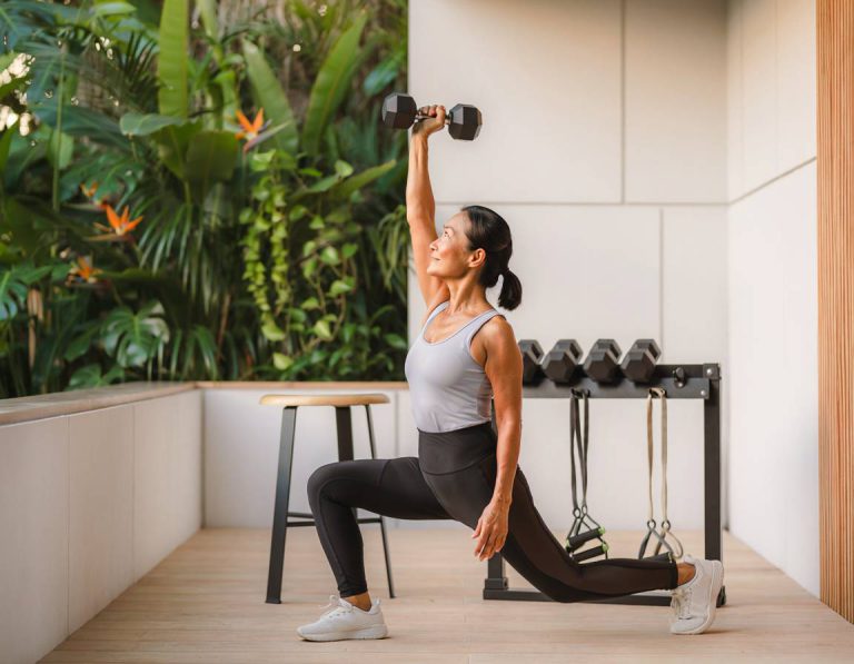 A woman performing press up lunges.